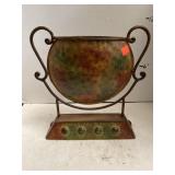 Decorative Antiqued Metal Urn and Stand.