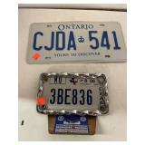 2 license plates. One w/ bracket.