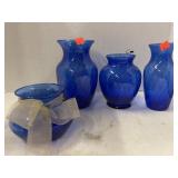 Lot of 4 Blue Glass vases. Swirled design.