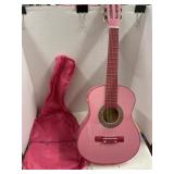 Pink Beginner guitar wi/ gig bag.