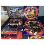 Lot of 7 NASCAR die cast & collectors tin.