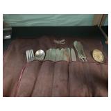 Rogers Silverware in cloth holder