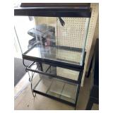 Double Aquarium on wrought iron stand. Top has