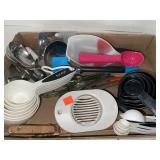 Lot of kitchen supplies / tools.