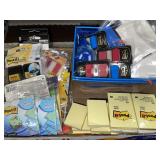 Lot of Post-It notes & storage baskets.
