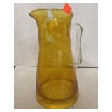 Amber Colored Pitcher. Some peeling. 8.5 in Tall