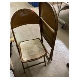 2 vintage metal folding chairs.