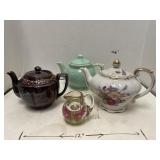 4 "tea pots". Incl paper weight & music box.