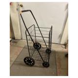 Shopping cart. 49in high overall. Basket