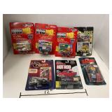 7 Collectable racing style cars. In sealed pkgs.