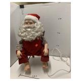 Sitting moving Santa decor