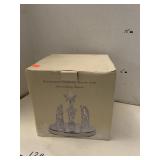 Illuminated nativity scene with Christmas music