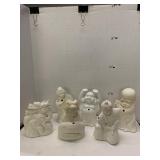 6 white figurine vases