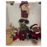 5 plush Christmas decor items.