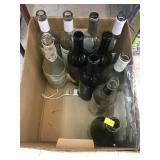 Empty Wine Bottles and Package of Doilies