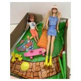 2 Barbie dolls, roller skating, outdoor scene