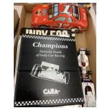 Racing Manual and books, tin, 2 toy cars