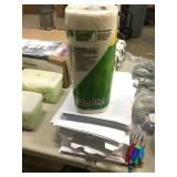 Stack of loose Computer Paper and Roll of Bounty