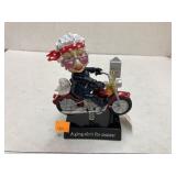 Aging motorcycle figure