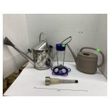 Watering cans, hummingbird feeder, & solar light