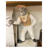 Concrete lawn jockey statue