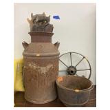 Cast iron pot & wagon wheel, metal milk jug, saws