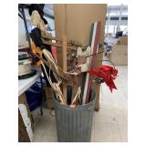 Metal Trashcan with Signs and Decor