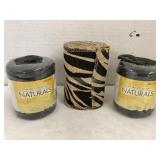 Rolls of black jute and zebra print burlap