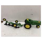 John Deere metal tractor and plow