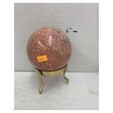 Polished stone orb and brass holder