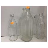 2 Coca Cola Bottles and a milk Bottle, Clear