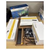 Linksys Router still in plastic wrap, docking