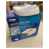 Raised toilet seat and chair pad