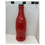 Red plastic Coke bottle bank