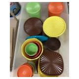 Tote full of Tupperware canisters, bowls, & extra