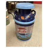 Painted metal milk can w/sign