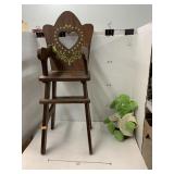 Wooden toy high chair and yoda toy