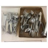 Flat and Bag of Stainless Steel Silverware