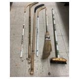 4cnt hockey sticks and 2 brooms