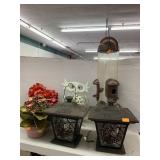 Lanterns, bird feeder, metal owl, flowers