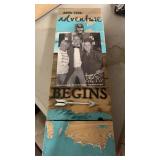 Adventure begins sign