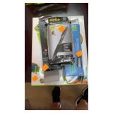 Ream of paper and pens, staplers
