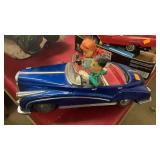 Metal car with people