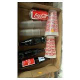 Coca-Cola bottles and cups