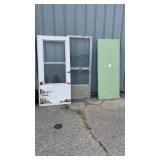 2 screen doors and green door