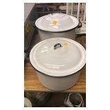 Enamel ware pots with lids.