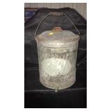 Metal bucket with spigot.