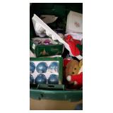 Tote of Christmas ornaments and decor