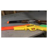 Two toy shotguns