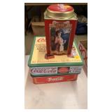3 Coca-Cola tins
